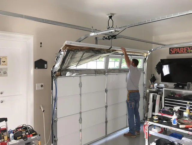 Garage door section replacement by Pembroke Garage Door Repair in Pembroke