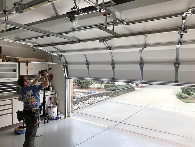 Garage door track repair service by Pembroke Garage Door Repair in Pembroke